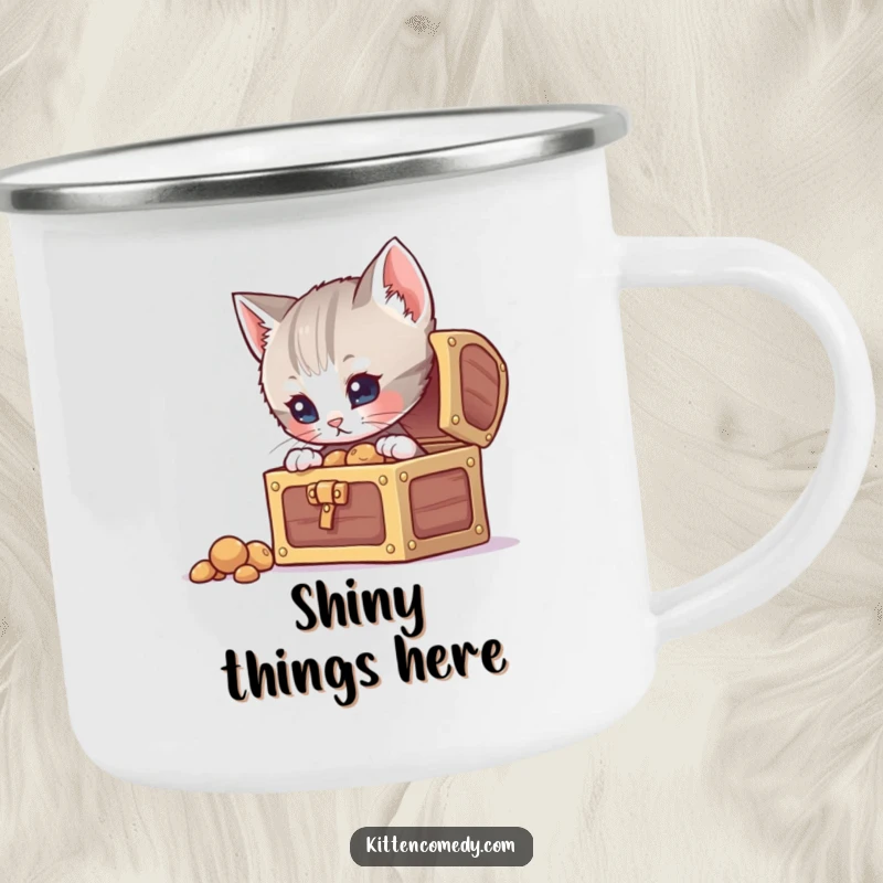 Funny curious kitten camping mug, peeking into a treasure chest, ready for outdoor adventures and discoveries.