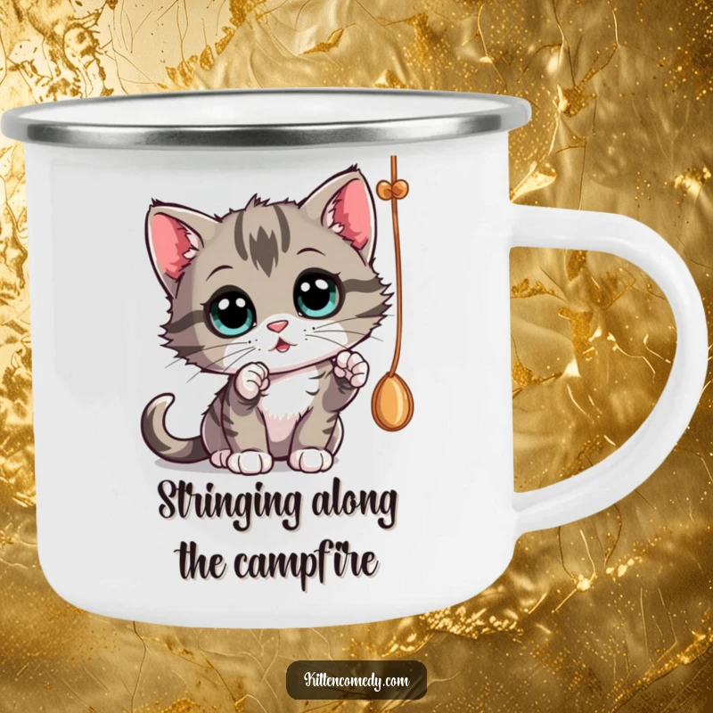 Funny curious kitten batting at a dangling string, a rugged camping mug for engaging outdoor gifts.