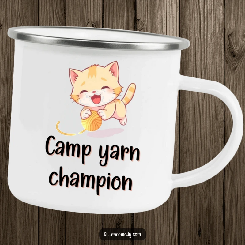 Funny kitten camping mug showing a joyful kitten tumbling while chasing a glowing yarn ball, perfect for outdoor fun and humor.