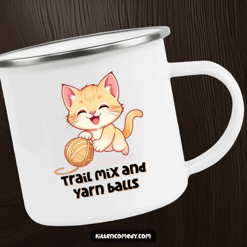 Funny happy kitten chasing a bouncing yarn ball, a rugged camping mug for humorous outdoor gifts.