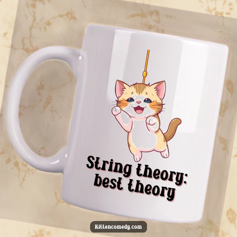 Funny kitten mug depicting a playful kitten excitedly pouncing on a dangling, sparkling string, full of energy and mischief.