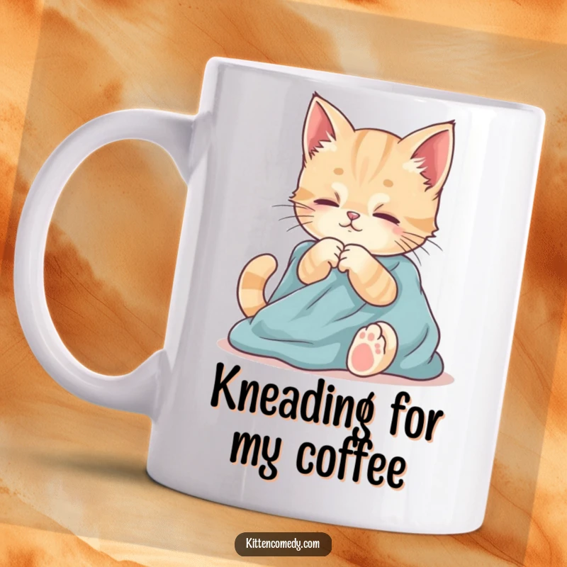 Funny mug showing a kitten contentedly kneading soft fabric with its paws. Embodies comfort and gentle playfulness.