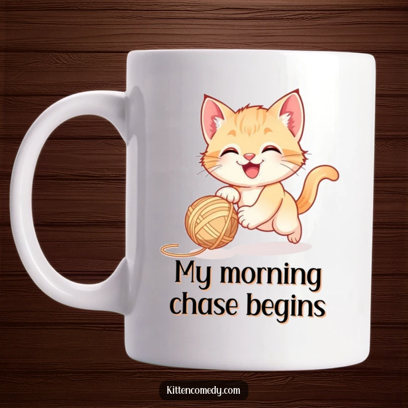 Funny happy kitten gleefully chasing a bouncing ball of colorful yarn, a playful mug gift.