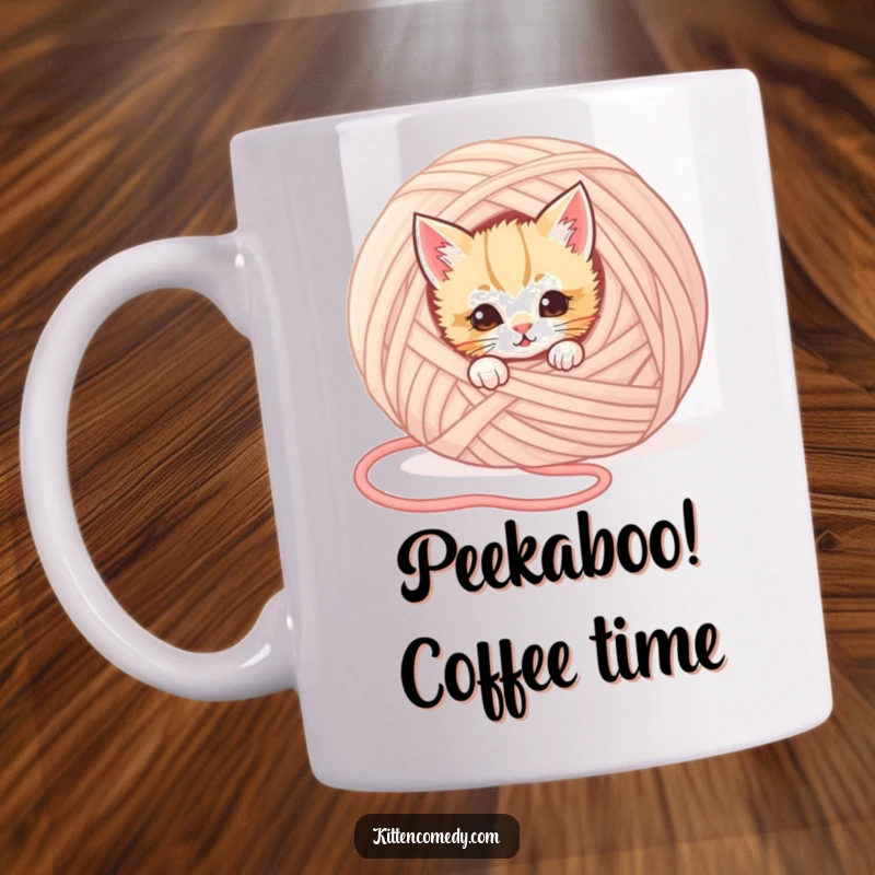 Funny kitten mug featuring a mischievous kitten peeking out from behind a giant ball of yarn, full of playful secrecy.