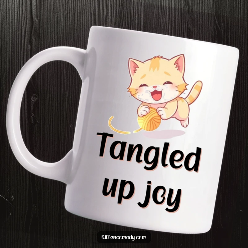 Funny kitten mug showing a joyful kitten happily tumbling while chasing a tiny, glowing ball of yarn, full of playful motion.