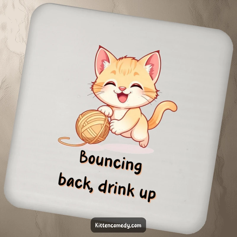 Funny happy kitten chasing a bouncing yarn ball on a coaster, adding playful protection.