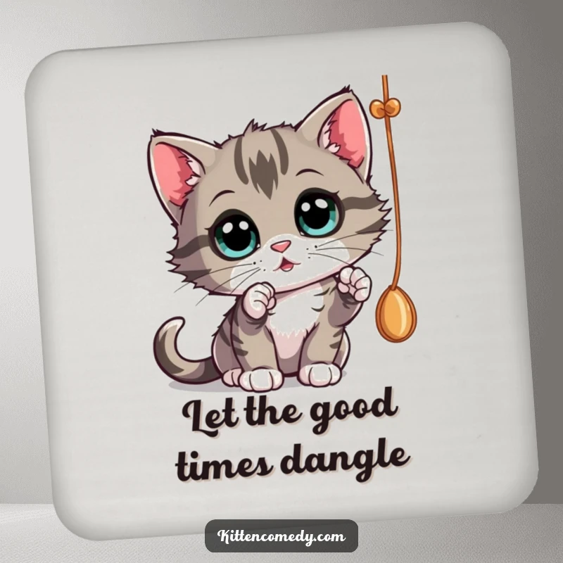 Funny curious kitten batting at a dangling string on a coaster, adding playful protection.