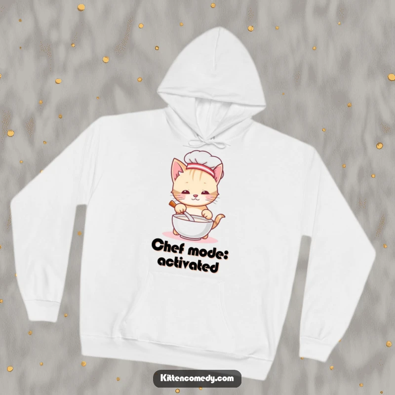Funny chef kitten hoodie, a cute cat in a chef hat stirring milk, exuding warmth and culinary charm. An adorable and humorous wearable.