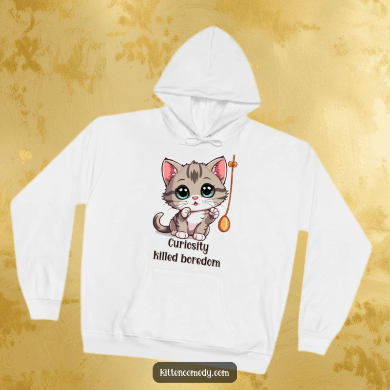 Funny curious kitten batting at a dangling string, a cozy hoodie for an engaging funny gift.