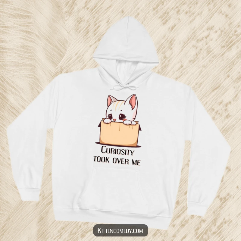Funny kitten peeking inquisitively into a mystery box, depicted on a comfortable hoodie, ready to bring smiles and warmth as a funny gift.