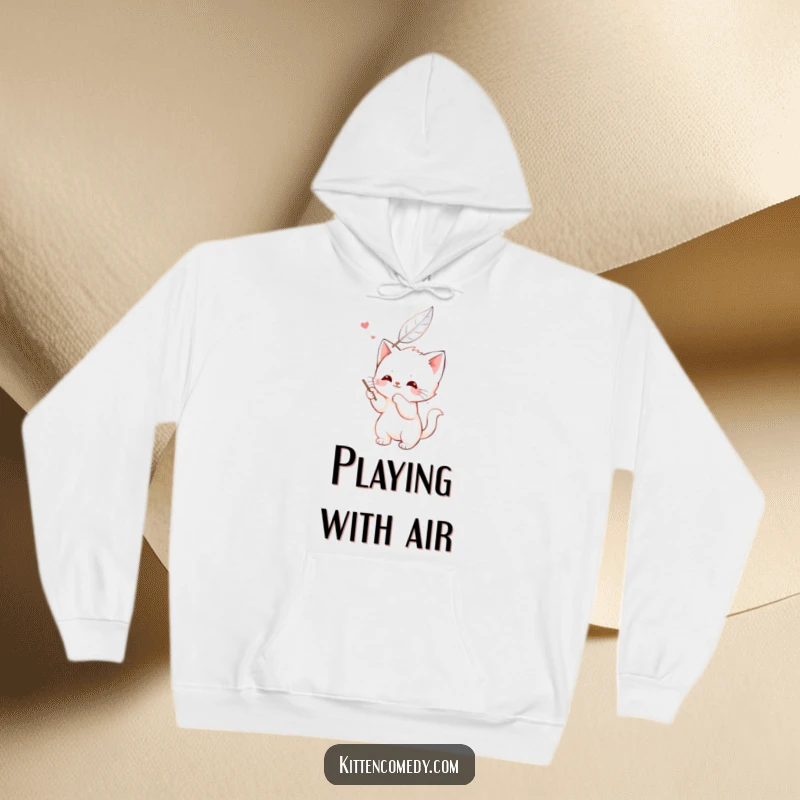 Funny kawaii kitten hoodie, happily batting at a feather, a cute and warm design for cat lovers.