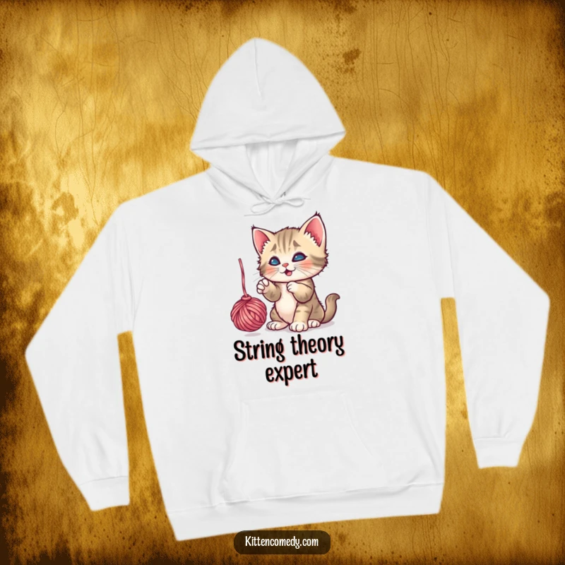 Funny Playful Kitten Yarn Hoodie: A kitten energetically batting a dangling ball of yarn, a cozy and funny gift.