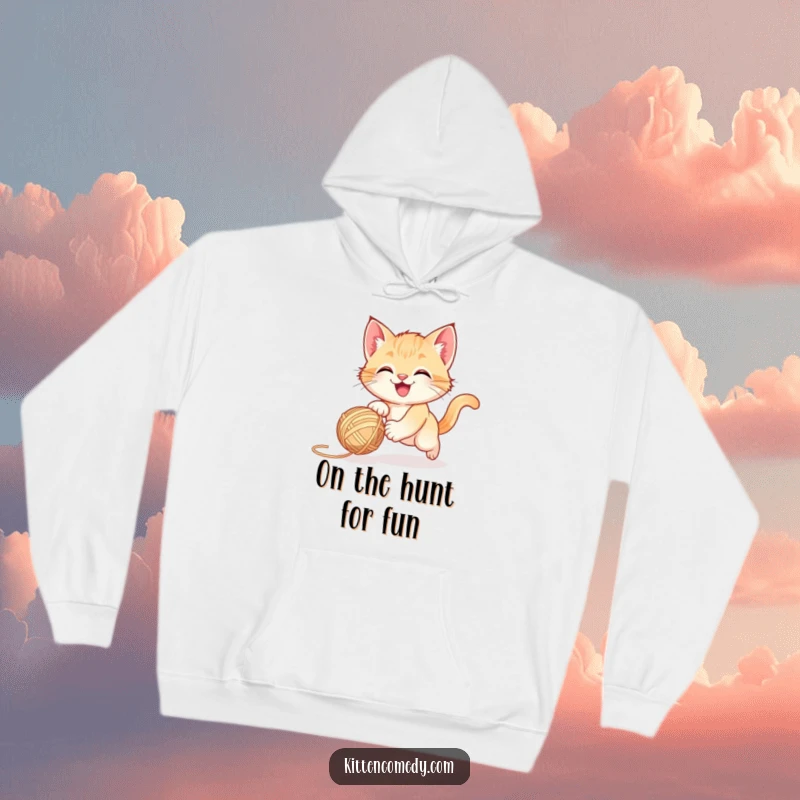 Funny happy kitten chasing a bouncing yarn ball, a cozy hoodie for a playful funny gift.