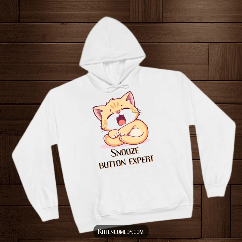 Funny Kitten Sunbeam Hoodie: A tired kitten yawning widely while nestled in a sunbeam, radiating cozy humor and comfort.