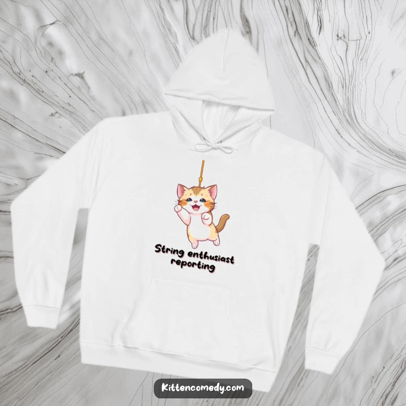 Funny kitten hoodie showing a cute kitten energetically pouncing towards a sparkling dangling string, radiating joyful mischief and fun.
