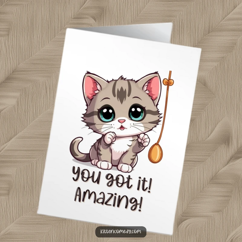 Funny Free Printable Congratulations Card: A curious kitten bats at a dangling string, capturing the wonder of achievement.