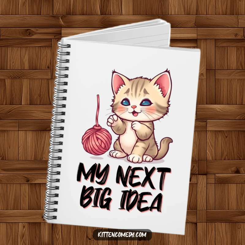 Funny Kitten Yarn Notebook: A playful kitten batting a dangling ball of yarn, perfect for jotting down ideas.