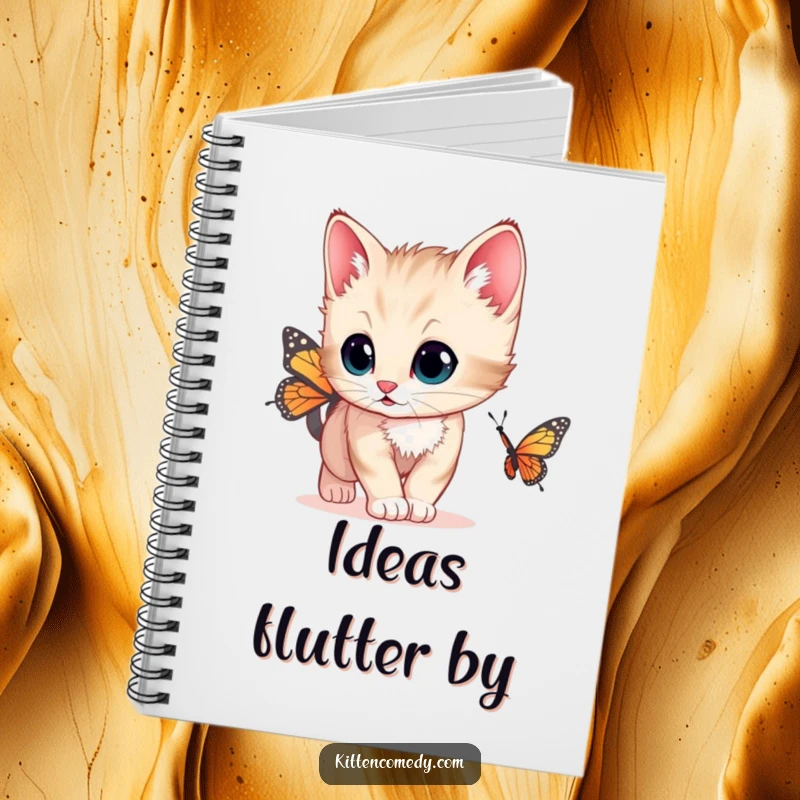 Funny cute notebook with a kitten with wide, curious eyes chasing a butterfly, ideal for capturing ideas and notes.