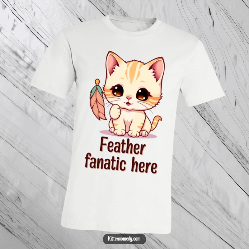 Funny Kawaii Kitten T-Shirt: A wide-eyed, adorable kitten joyfully swats at a dangling feather, capturing pure playful abandon.