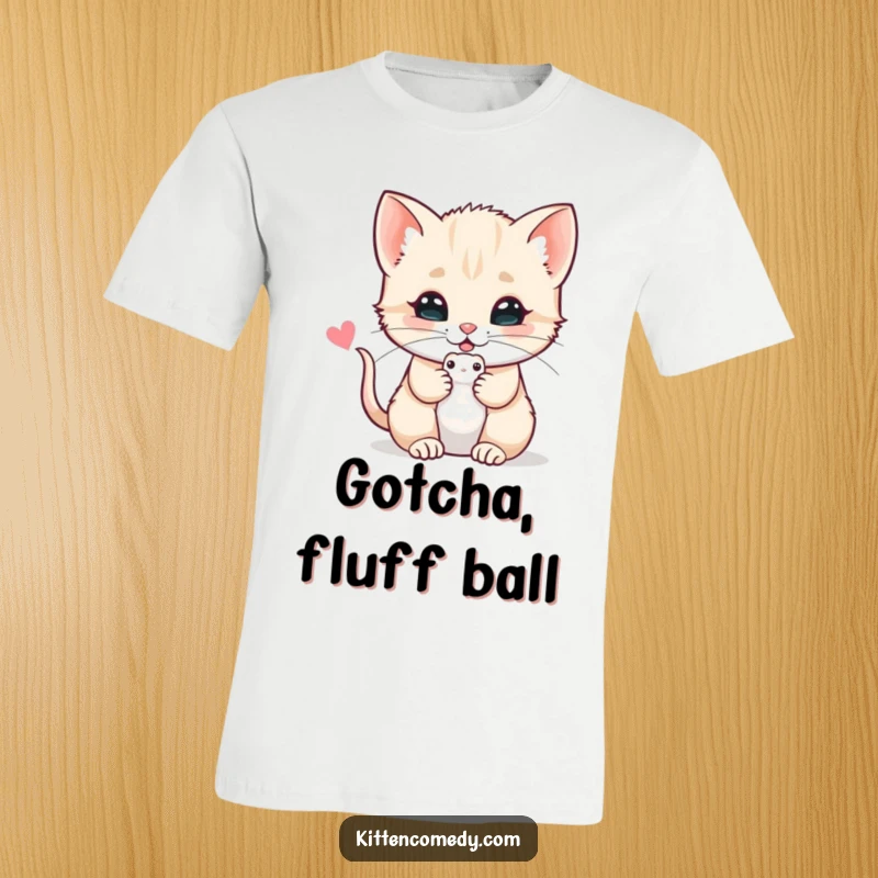 Funny t-shirt featuring a kitten offering a toy mouse with a purr, celebrating playful innocence and feline affection.
