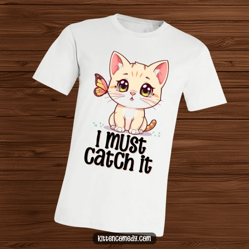Funny Kawaii Kitten T-Shirt: A cute, wide-eyed kitten gazing intently at a butterfly, embodying pure fascination.