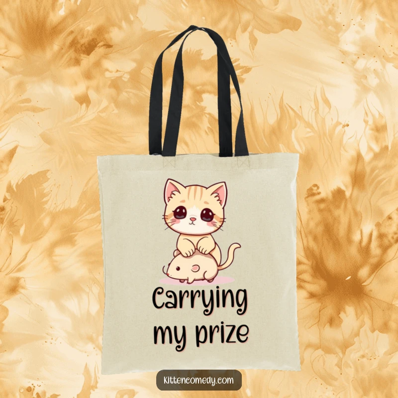 Funny Kawaii Kitten Tote Bag: A practical tote showcasing a playful kitten making a toy mouse its throne.