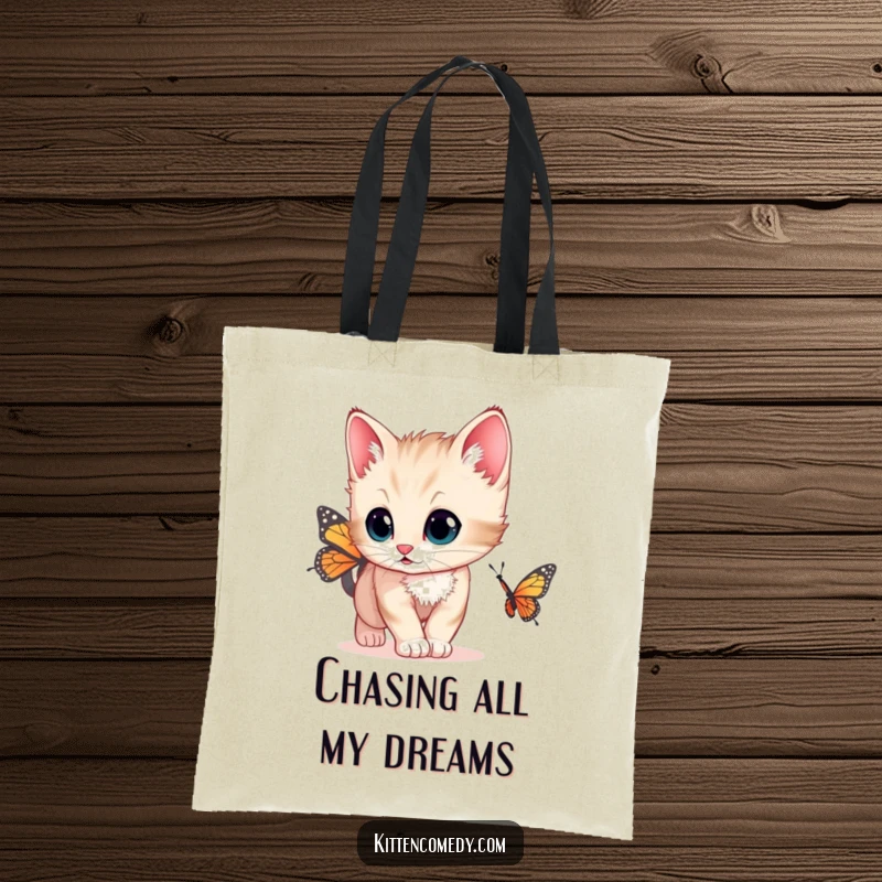 Funny tote bag featuring a kitten with wide, curious eyes chasing a butterfly, a charming accessory for cat lovers.