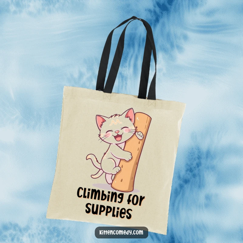 Funny tote bag showcasing a kitten enthusiastically climbing a scratching post. Great for books, groceries, or cat toys.