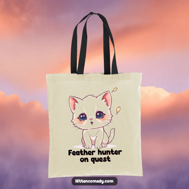 Funny tote bag featuring a kitten with wide, surprised eyes reacting to a falling feather. Great for essentials and amusement.